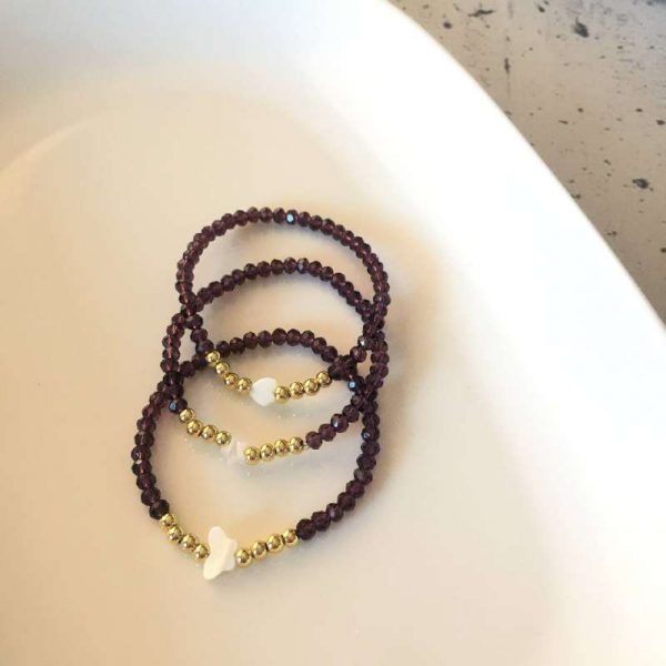 Pulsera de Cristales Morados con Dijes en Nácar
